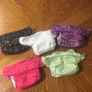 12 gently used cloth diapers